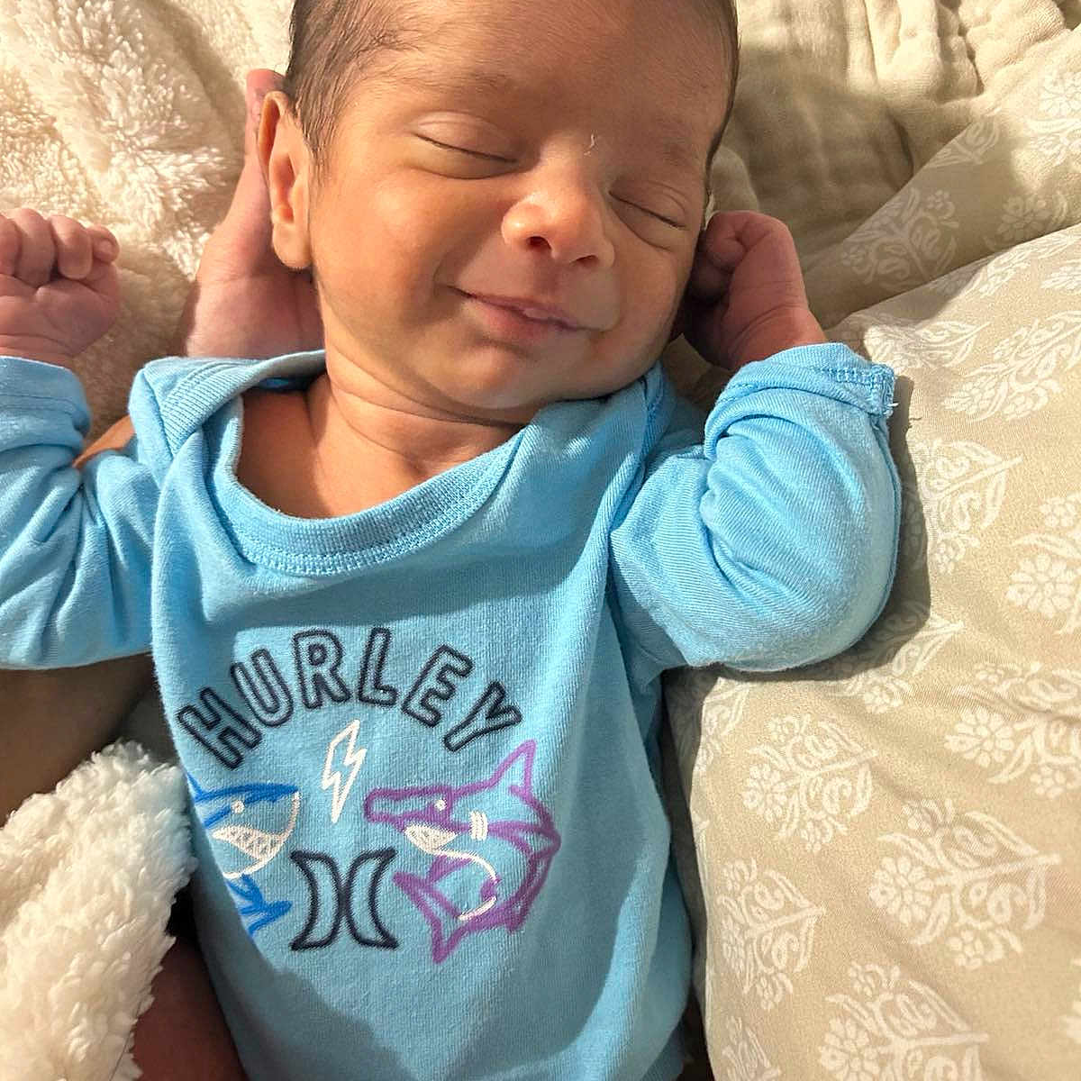 Alexander Appolo is registered to the contest to win money with this photo: baby, baby_clothes, blanket, blue_onesie, clothing, cozy, cute, face, hand, head, human, indoor, infant, newborn, portrait, resting, skin, sleeping, smile, soft