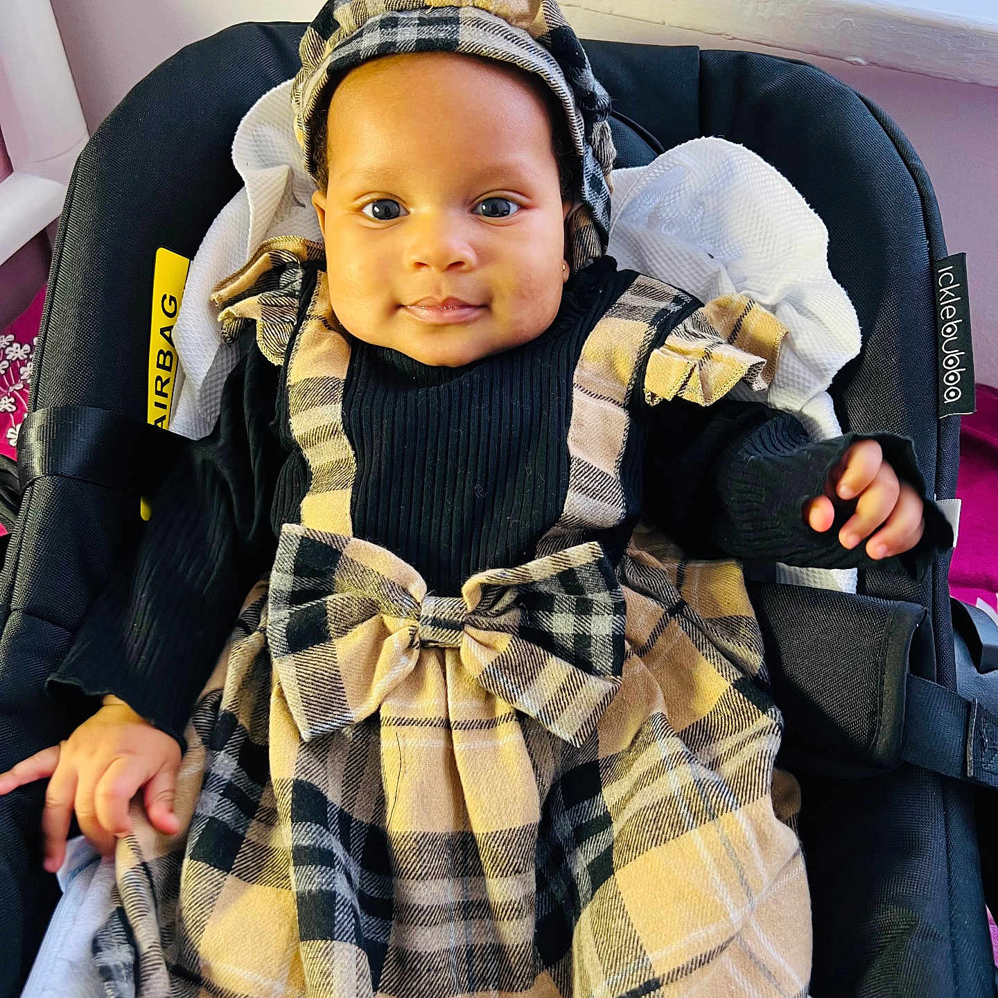 Jasmine is registered to the contest to win money with this photo: baby, blanket, bodypart, bonnet, cap, clothing, coat, couch, cushion, face, finger, furniture, hand, hat, head, homedecor, pants, person, photography, portrait