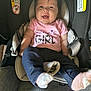 baby, infant, car_seat, smiling, pink_shirt, mamas_girl, socks, blue_pants, happy, child, person, seat_belt, warning_label, indoor, cute, clothing, newborn, seat, straps, portrait
