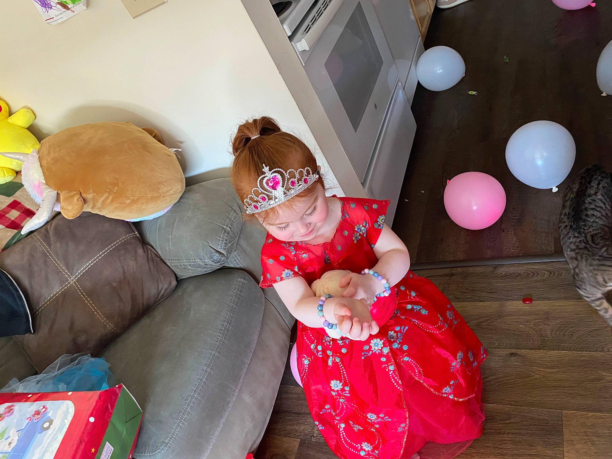Myah joined the competition — help win amazing prizes! child, christmas, comfort, couch, event, flooring, fun, happy, hat, holiday, lap, living_room, magenta, person, play, room, sitting, thigh, toddler, toy