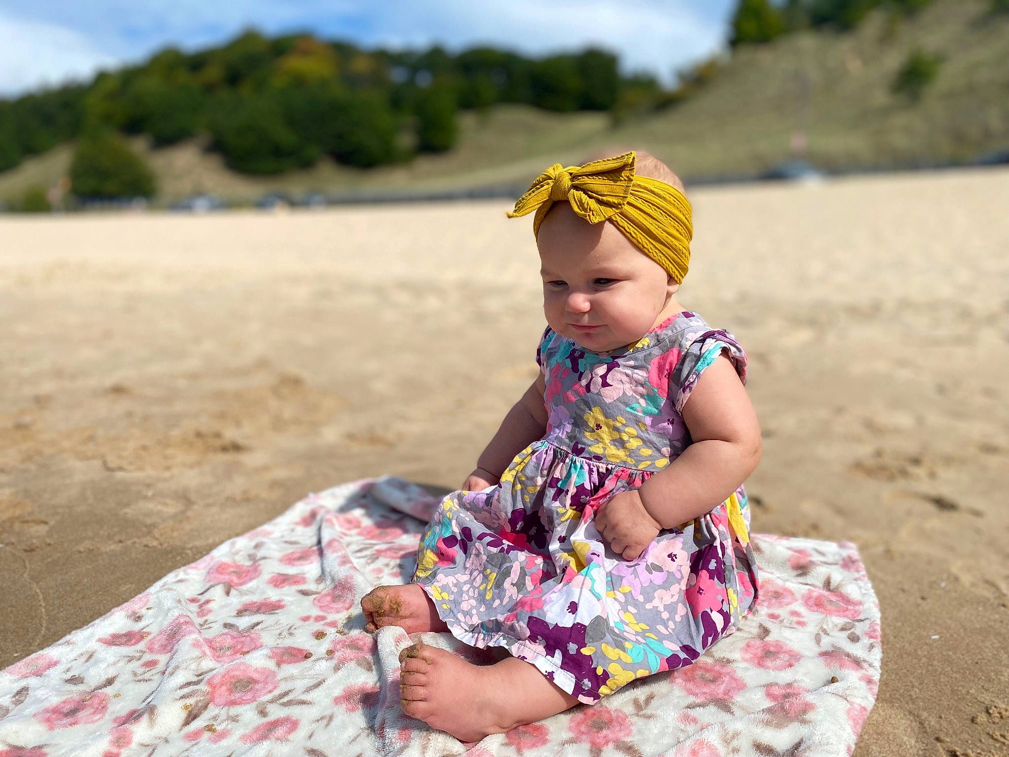 Haylin joined the competition — help win amazing prizes! baby_toddler_clothing, beach, body_of_water, cloud, dress, fun, grass, happy, hat, headwear, landscape, leisure, natural_environment, people_in_nature, person, sand, shore, sky, summer, toddler