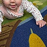 Bella is registered to the contest to win money with this photo: baby, cheeks, child, closeup, colorful, crawling, cute, eyes, fabric, face, hand, indoors, infant, onesie, patterned_rug, play_rug, portrait, smile, straw_hat, toy_area