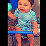 Justin is registered to the contest to win money with this photo: baby, barefoot, blue_outfit, cheerful, child, cute, dinosaur_print, happy, holding, indoor, infant, person, seated, shopping, shopping_cart, sippy_cup, smiling, store_floor, toddler, toy