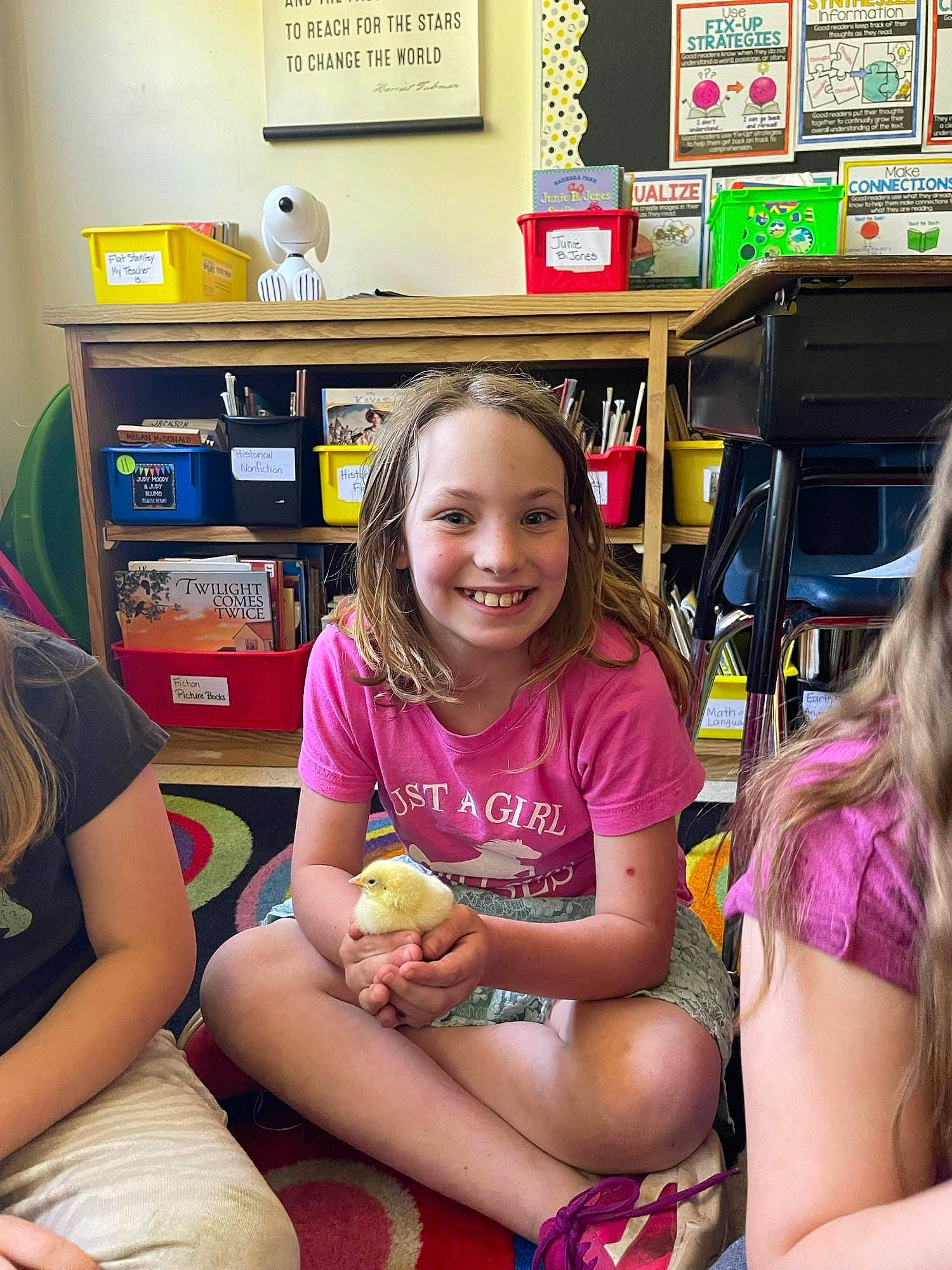 Katarina is registered to the contest to win money with this photo: chair, child, event, fun, happy, human_leg, joy, knee, lap, leisure, long_hair, magenta, person, picture_frame, room, shelf, shelving, sitting, smile, snapshot
