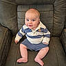 baby, child, infant, blue_eyes, striped_shirt, polo_shirt, shorts, smile, sitting, leather_chair, furniture, indoor, cute, portrait, person, human, young, skin, legs, feet