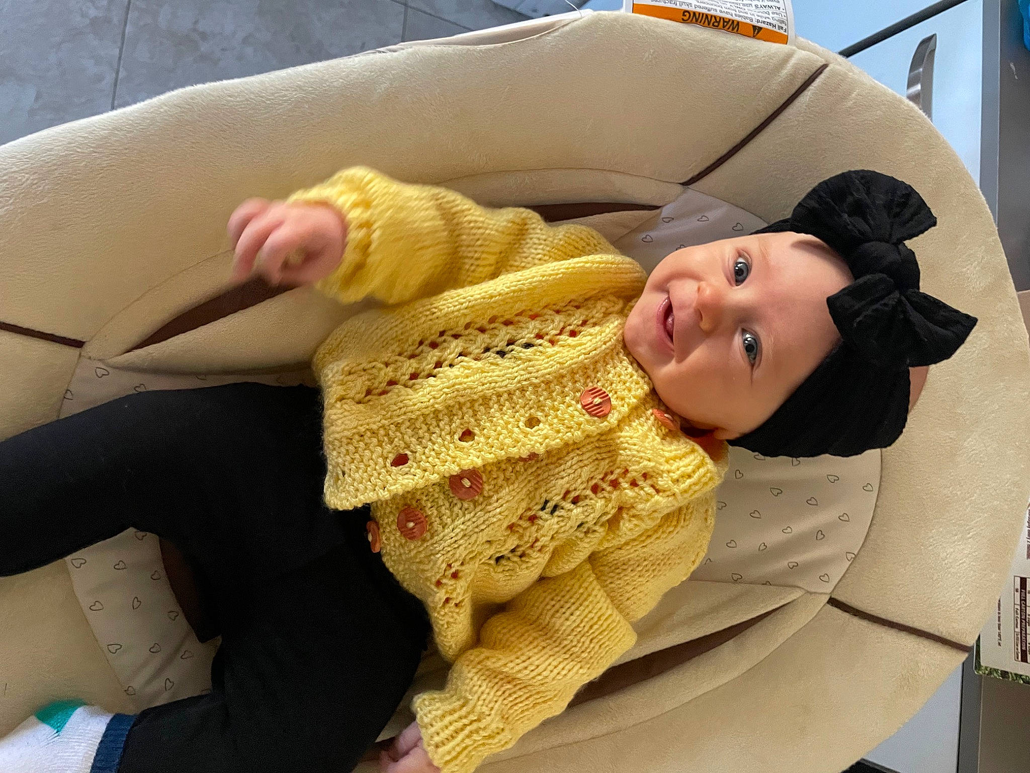 Kay is registered to the contest to win money with this photo: baby, baby_products, baby_sleeping, baby_toddler_clothing, car_seat, comfort, finger, headgear, headwear, joint, lap, linens, outerwear, person, sitting, skin, sky, sleeve, smile, textile