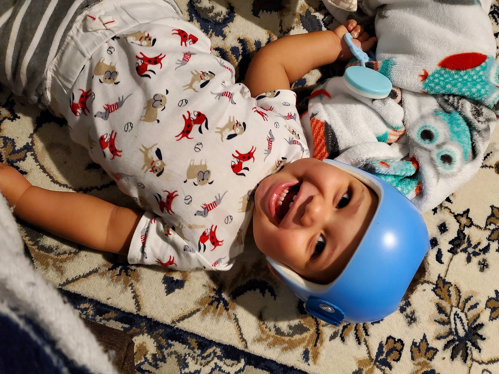 Lj is registered to the contest to win money with this photo: baby, baby_toddler_clothing, child, comfort, eye, facial_expression, flooring, fun, happy, headgear, headwear, human_body, human_leg, joy, mouth, pattern, person, skin, sleeve, smile