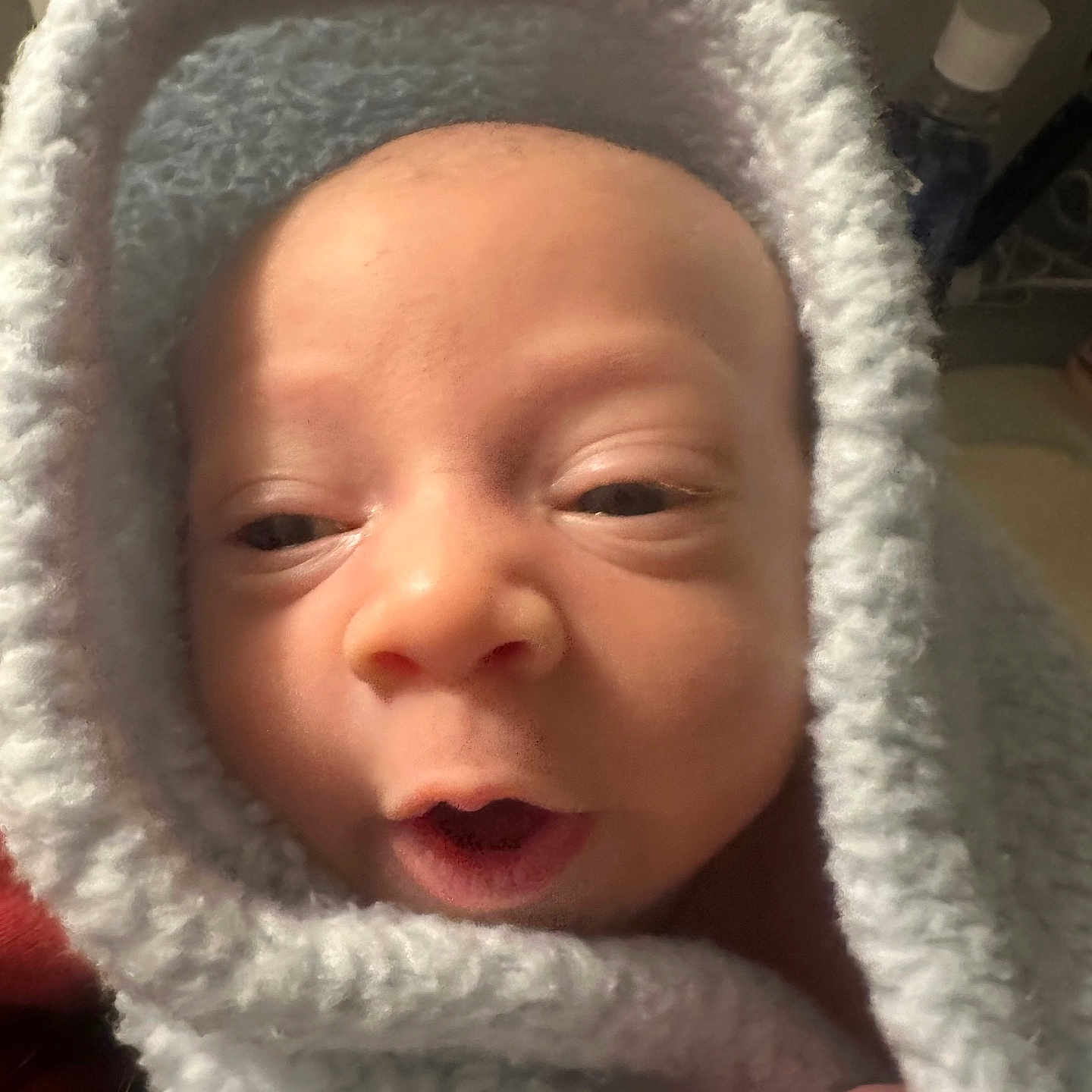 Nolan joined the competition — help win amazing prizes! baby, blanket, child, close_up, comfort, cozy, cute, expression, face, hand, head, indoor, infant, newborn, portrait, skin, soft_texture, warm, wrapped, young