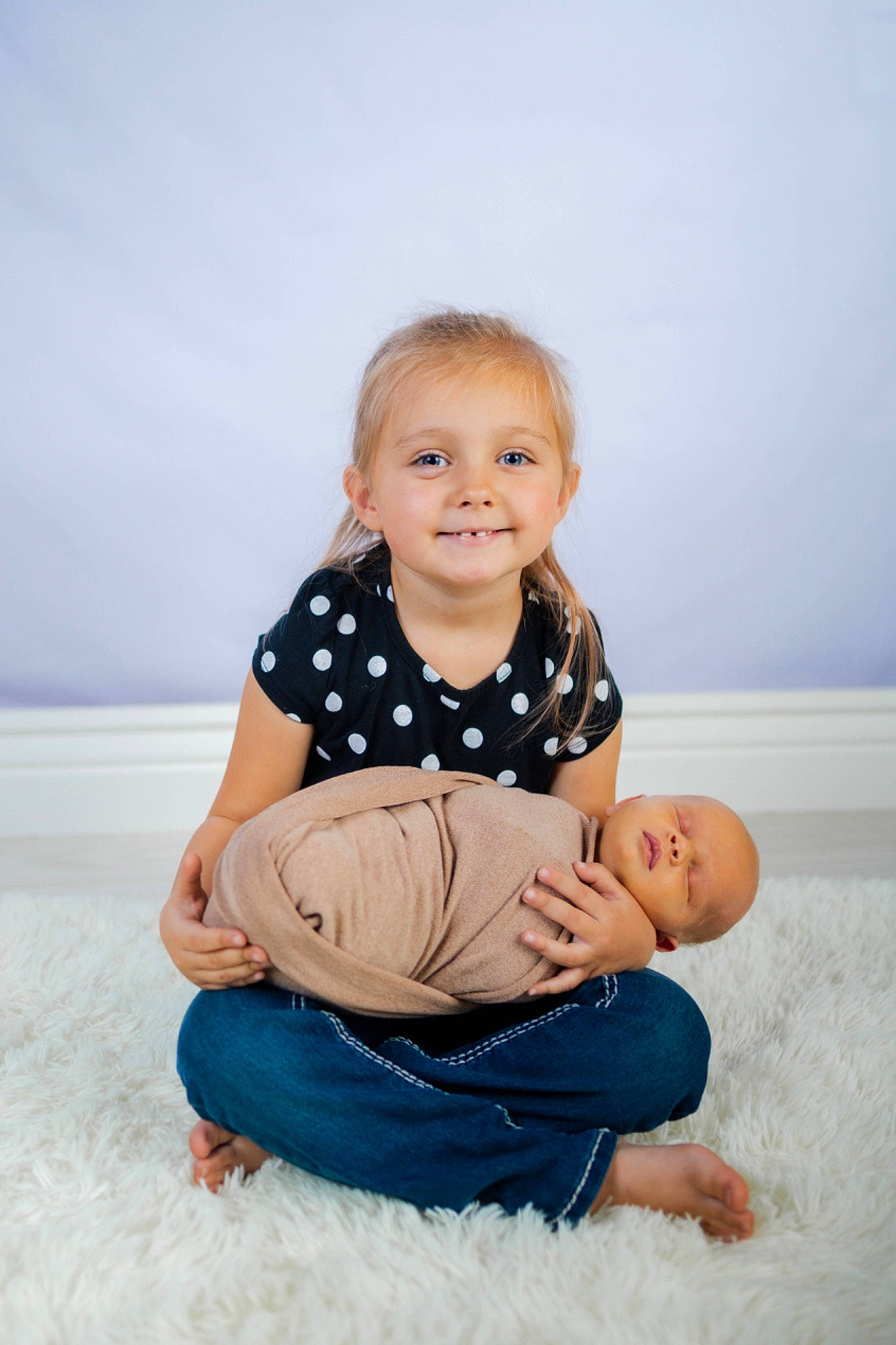 Athena is registered to the contest to win money with this photo: arm, azure, baby, baby_toddler_clothing, barefoot, child, comfort, flash_photography, fun, gesture, hand, happy, jeans, joy, leg, leisure, person, skin, sleeve, smile