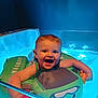 Judith a rejoint le concours — aidez-le/la à gagner de superbes lots ! baby, child, smiling, floatie, water, bathtub, toy, blue_light, happy, infant, swimming, splash, indoor, playful, cute, person, floating, young_child, fun, bath