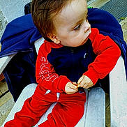 Gabryell participe au concours pour gagner de l'argent avec cette photo : casual, chair, child, doorway, face, floor, focused, hair, hand, jacket, navy_clothing, outdoor, portrait, red_clothing, sitting, snack, toddler, white_shoes, window, young_child