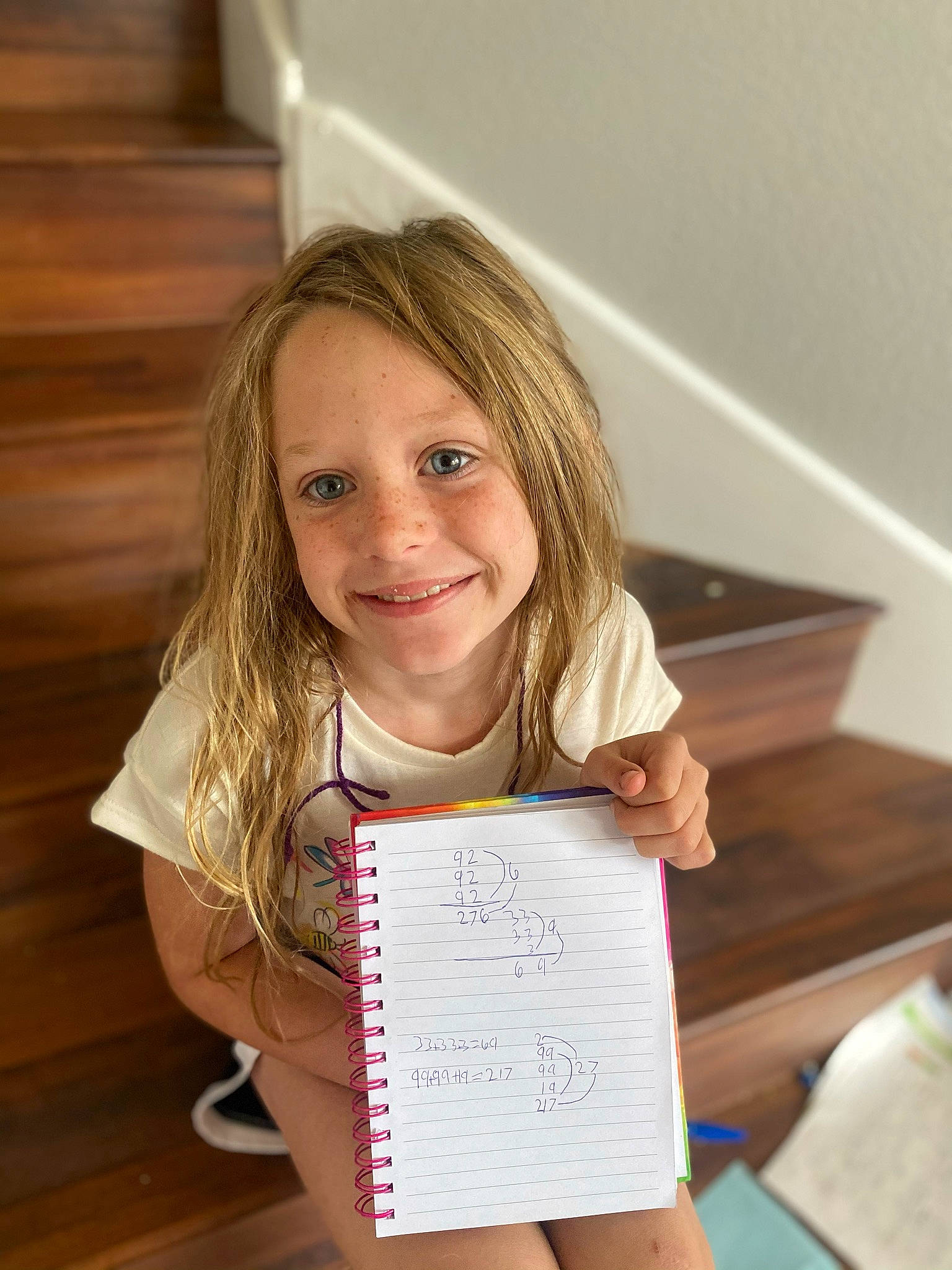 Kennedy is registered to the contest to win money with this photo: blond, chair, child, dress, flooring, fun, hair, handwriting, happy, hardwood, joy, person, portrait_photography, room, sitting, smile, t_shirt, toddler, wood, wood_flooring