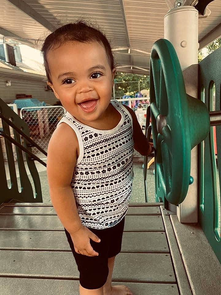 Karma is registered to the contest to win money with this photo: baby_toddler_clothing, child, chin, cool, eye, facial_expression, fun, green, hair, happy, joint, joy, leisure, person, shoulder, skin, sleeve, smile, standing, thigh