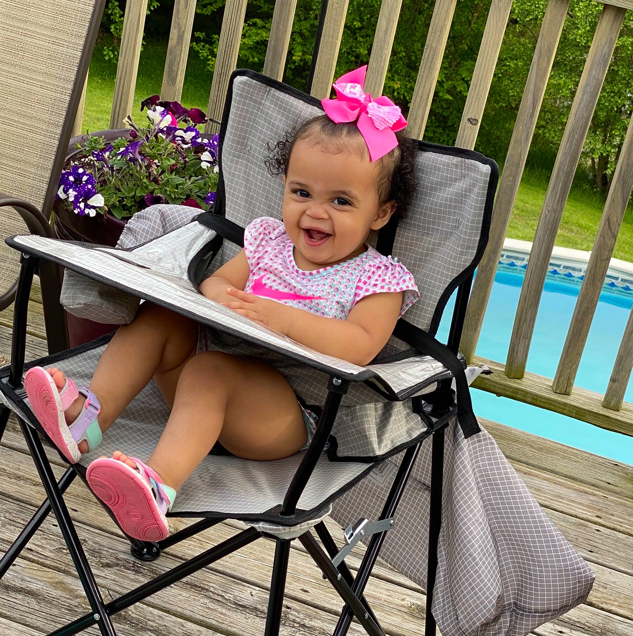 Karma joined the competition — help win amazing prizes! baby_carriage, baby_toddler_clothing, chair, child, comfort, face, furniture, hairstyle, happy, lap, leisure, magenta, outdoor_furniture, person, pink, plant, product, smile, summer, toddler