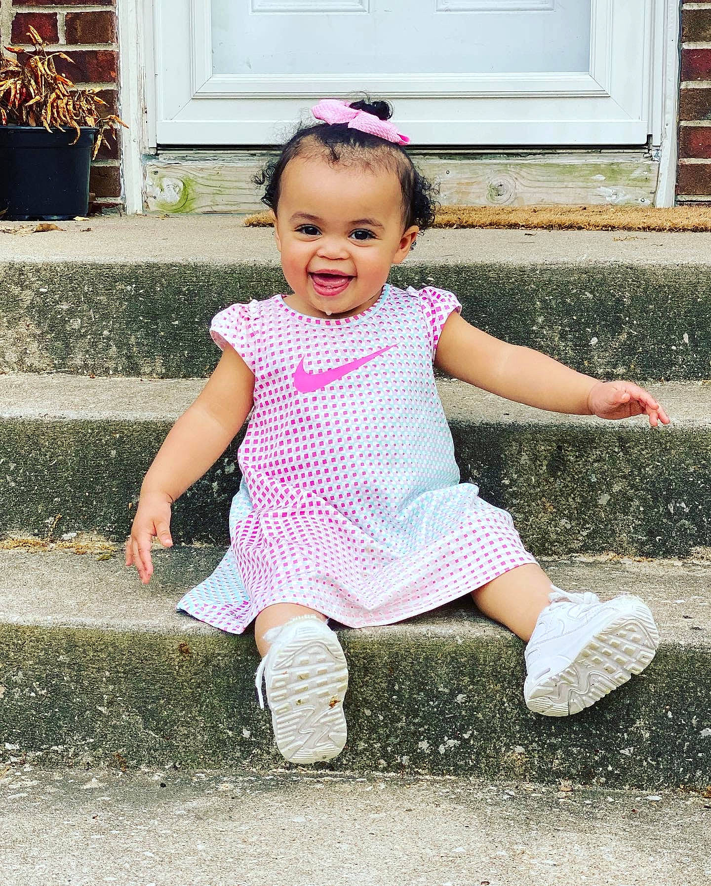 Karma joined the competition — help win amazing prizes! baby_toddler_clothing, door, dress, eye, face, flowerpot, fun, grass, happy, houseplant, joy, leisure, pattern, people_in_nature, person, pink, sleeve, smile, snapshot, toddler