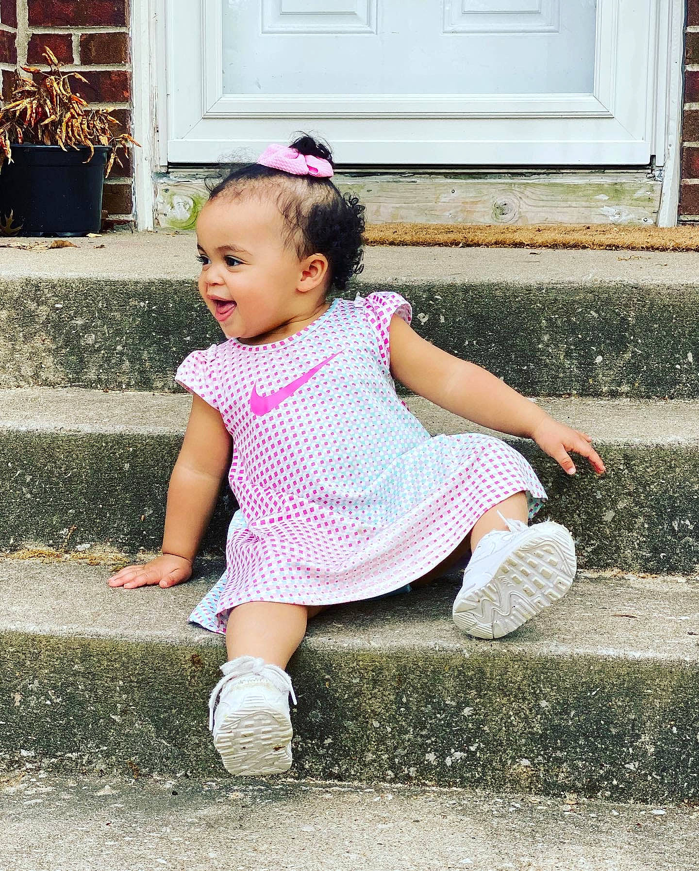 Karma joined the competition — help win amazing prizes! baby_toddler_clothing, blue, child, door, facial_expression, fun, grass, hairstyle, happy, head, houseplant, person, pink, plant, shoe, sleeve, smile, standing, toddler, white