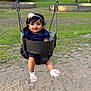 baby, child, clothing, cute, flower, fun, grass, happy, headband, metal, nature, outdoor, park, person, playground, sand, seat, smile, socks, swing