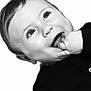 baby, infant, face, hand, fingers, black_and_white, portrait, curious, looking_up, clothing, child, cute, expression, head, young, small, skin, person, closeup, monochrome
