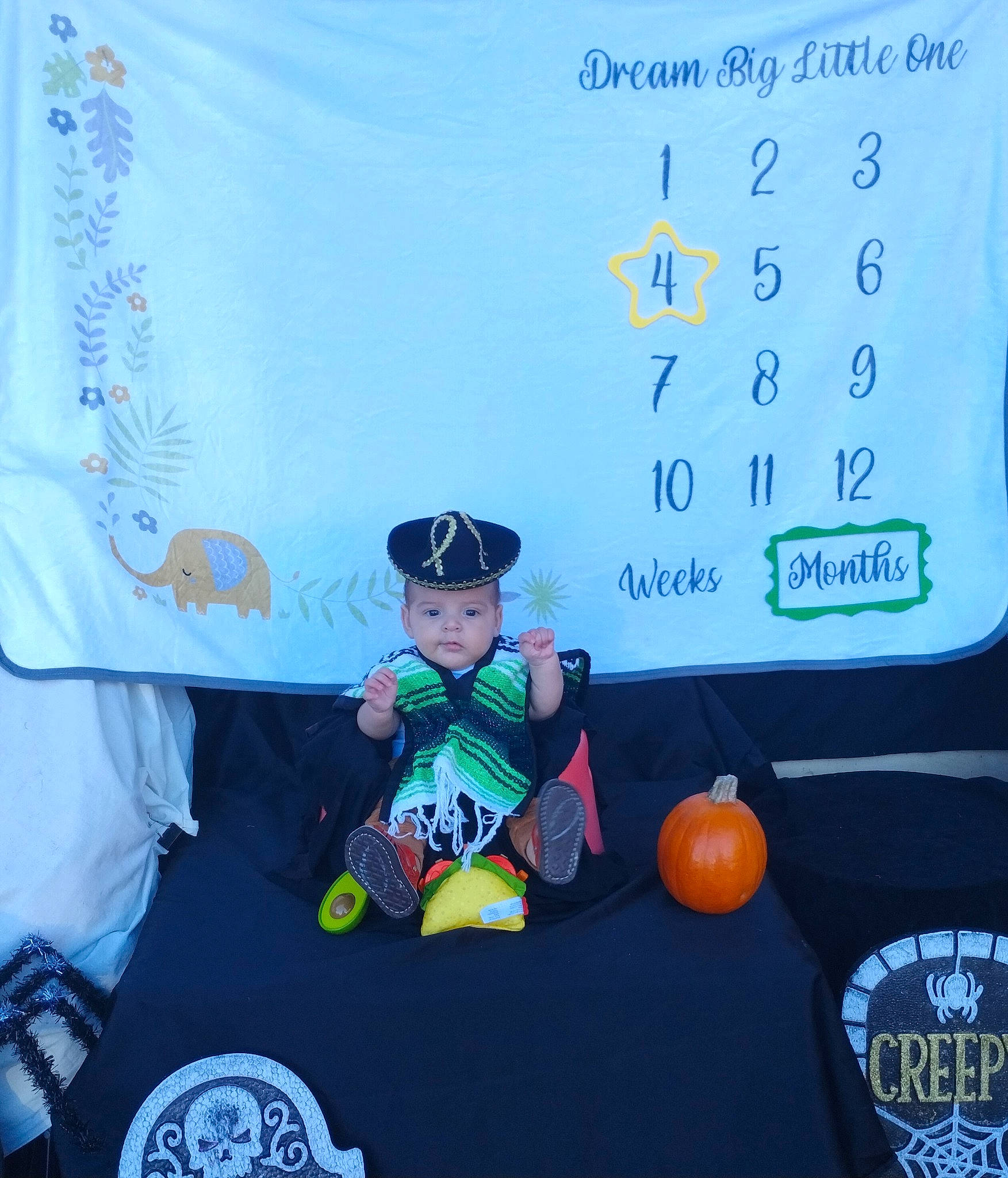 Emory is registered to the contest to win money with this photo: advertising, animation, brand, calabaza, child, electric_blue, event, font, fun, happy, hat, headwear, logo, person, pumpkin, room, sleeve, toddler, trick_or_treat, vegetable
