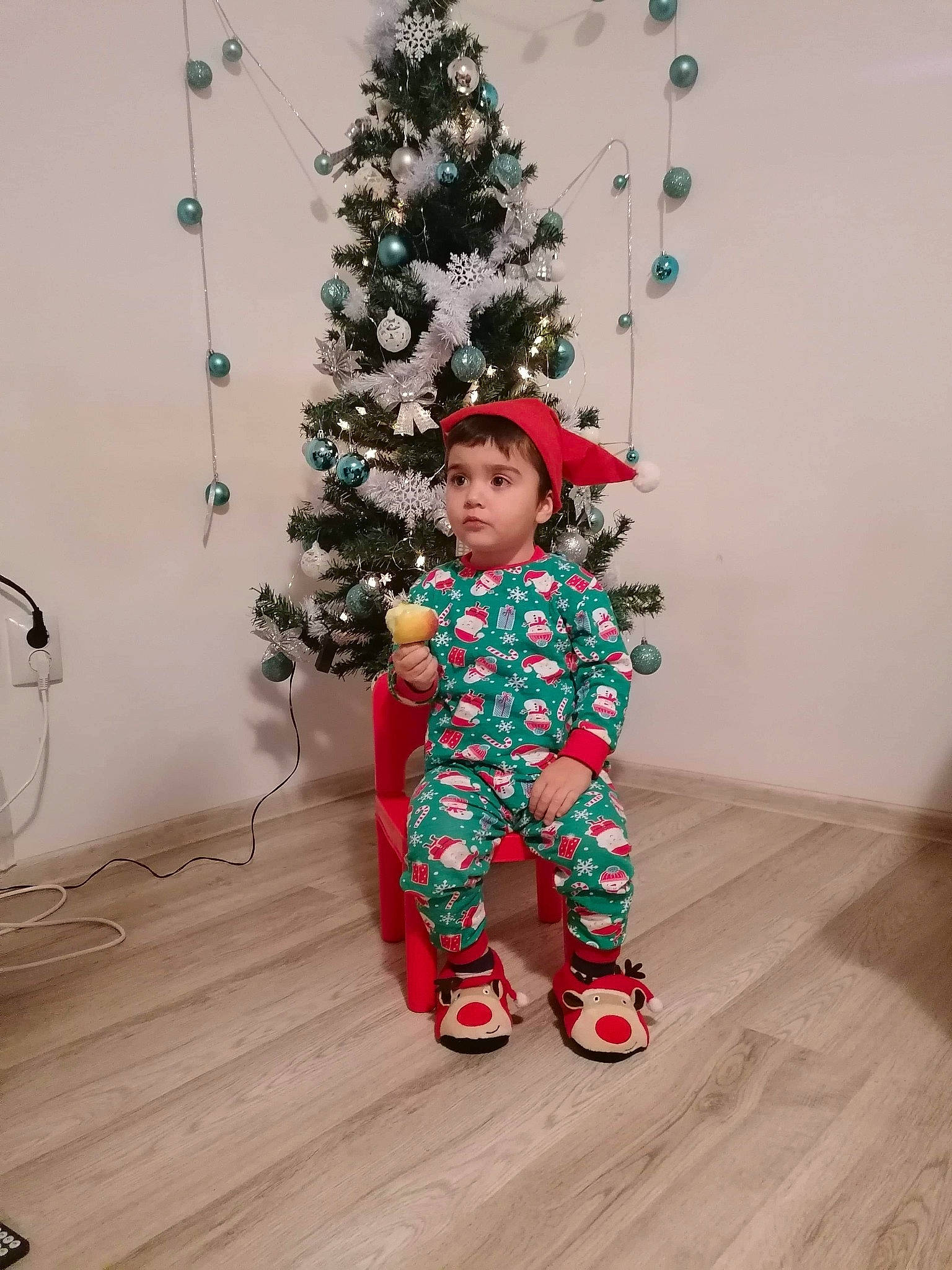 Matei is registered to the contest to win money with this photo: baby_toddler_clothing, christmas, christmas_decoration, christmas_ornament, christmas_tree, conifer, event, evergreen, flooring, happy, hardwood, holiday, holiday_ornament, interior_design, ornament, person, sleeve, toddler, winter, wood