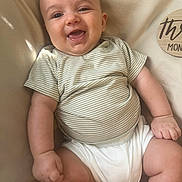 Walker joined the competition — help win amazing prizes! baby, child, smiling, striped_shirt, white_clothing, infant, soft_surface, milestone_marker, skin, cute, happy, furniture, portrait, one_person, young_child, sitting, indoors, chubby, baby_girl, baby_boy