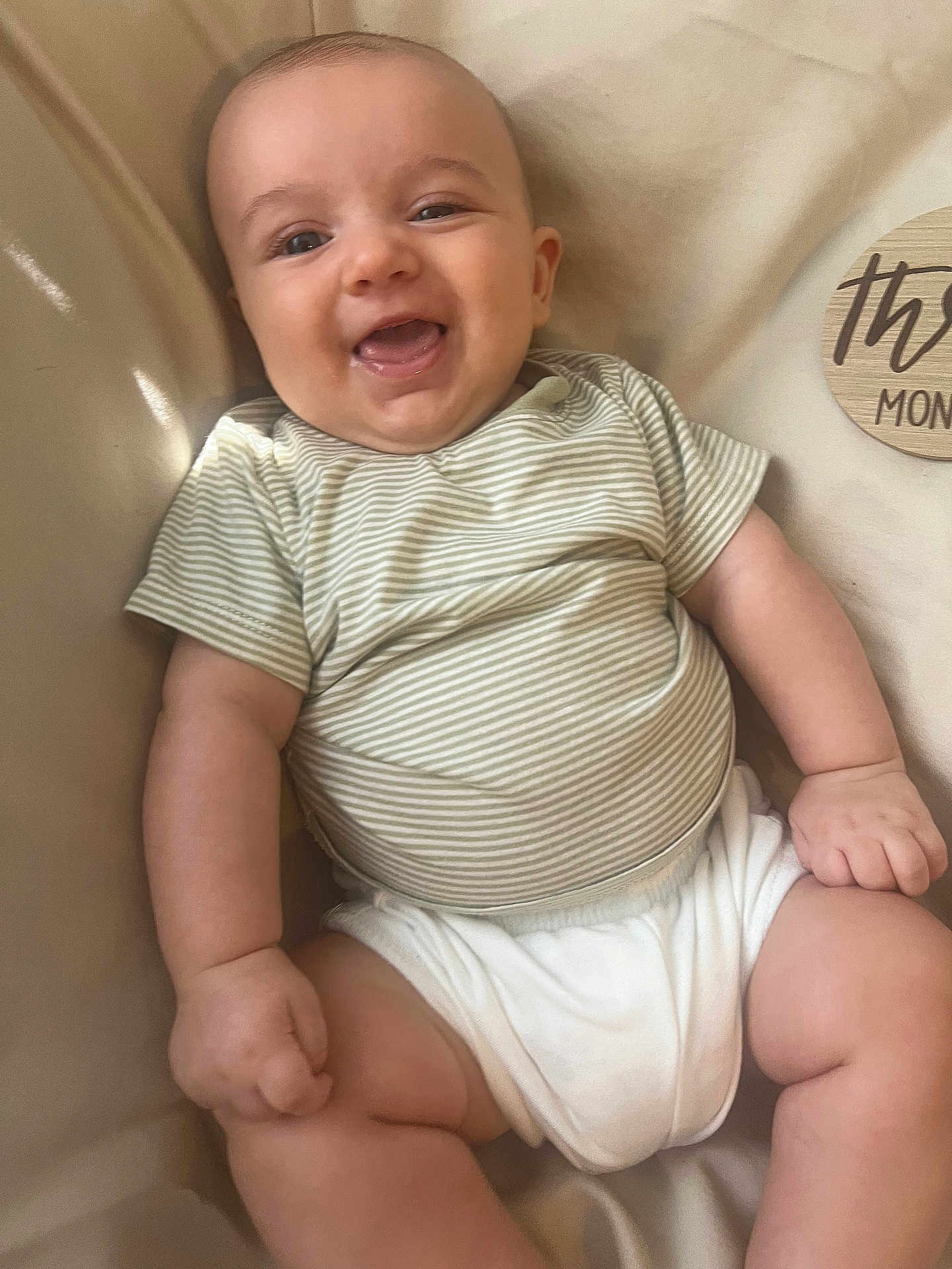 Walker joined the competition — help win amazing prizes! baby, child, smiling, striped_shirt, white_clothing, infant, soft_surface, milestone_marker, skin, cute, happy, furniture, portrait, one_person, young_child, sitting, indoors, chubby, baby_girl, baby_boy