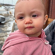 Zayla is registered to the contest to win money with this photo: toddler, child, face, pink_jacket, outdoor, winter, snow, earrings, closeup, expression, person, portrait, fleece, clothing, head, young_child, curious, casual, daylight, cold_weather