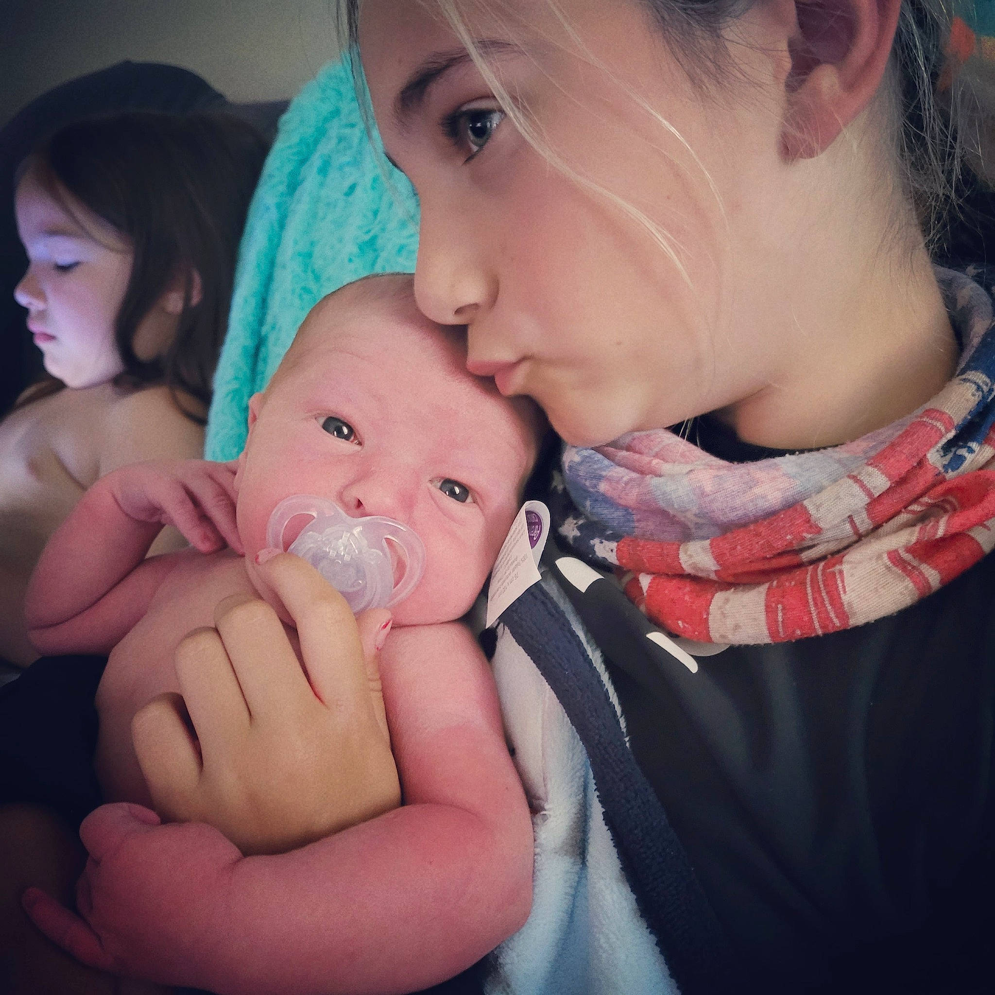 Rylie joined the competition — help win amazing prizes! cheek, chin, dress, ear, eye, eyebrow, eyelash, finger, flash_photography, gesture, hair, happy, interaction, iris, kiss, lip, mouth, neck, nose, person