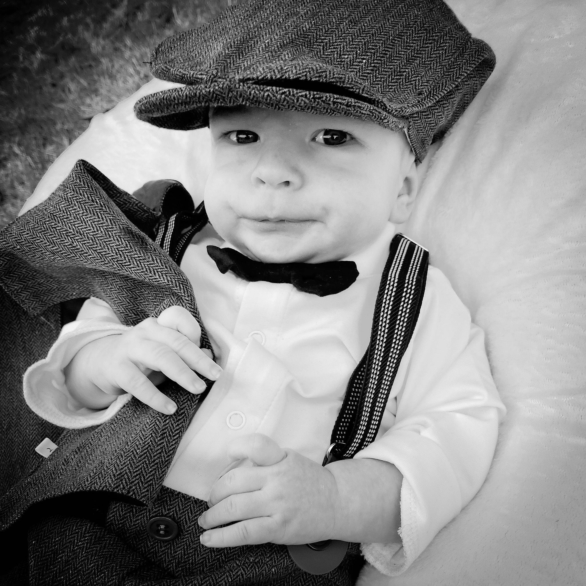 Deklan joined the competition — help win amazing prizes! baby_toddler_clothing, black, black_and_white, cap, collar, costume_hat, facial_expression, flash_photography, gesture, hand, happy, hat, headgear, headwear, lip, organ, outerwear, person, sleeve, style