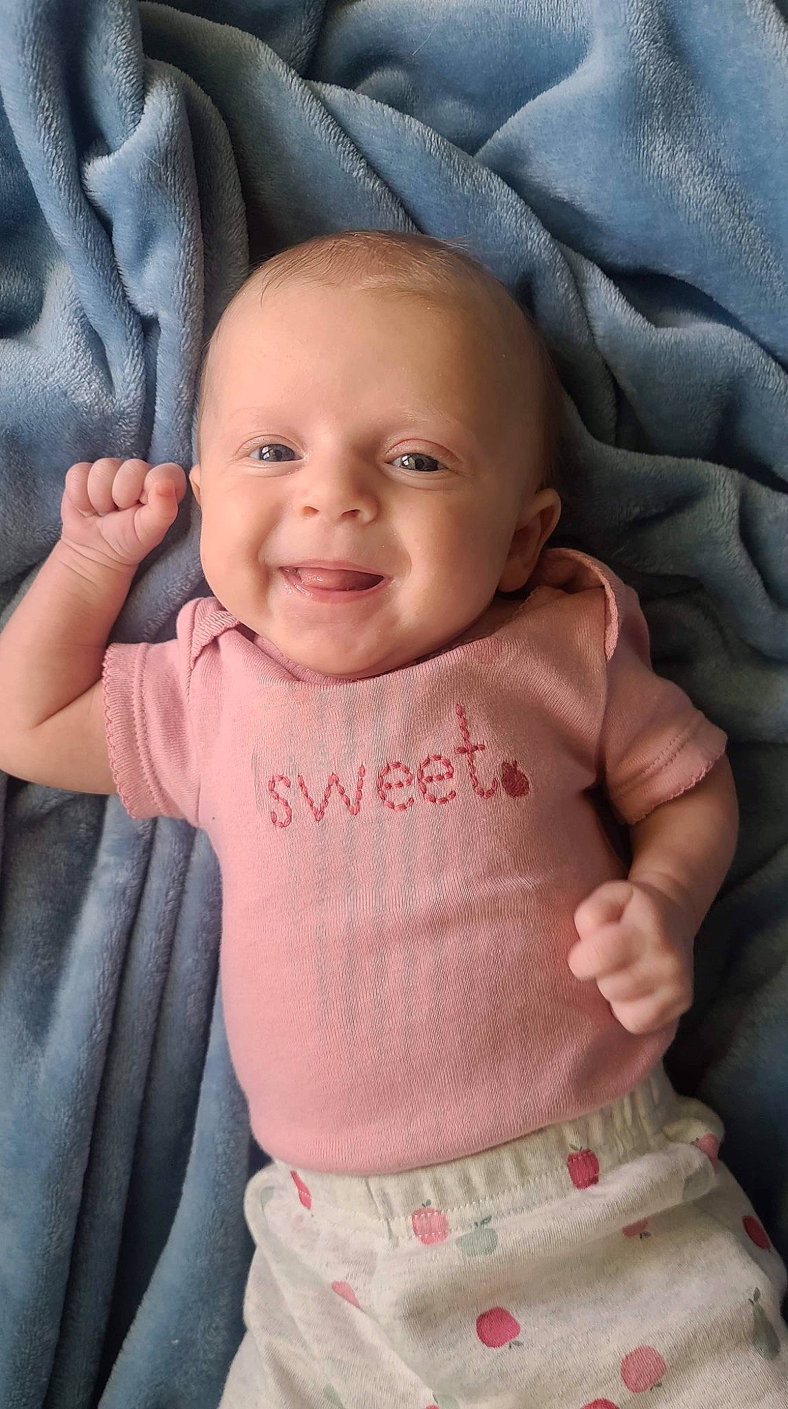 Elizabeth is registered to the contest to win money with this photo: baby_toddler_clothing, cheek, chin, comfort, eye, eyebrow, face, head, joy, lip, mammal, nose, organ, outerwear, person, product, skin, sleeve, smile, standing