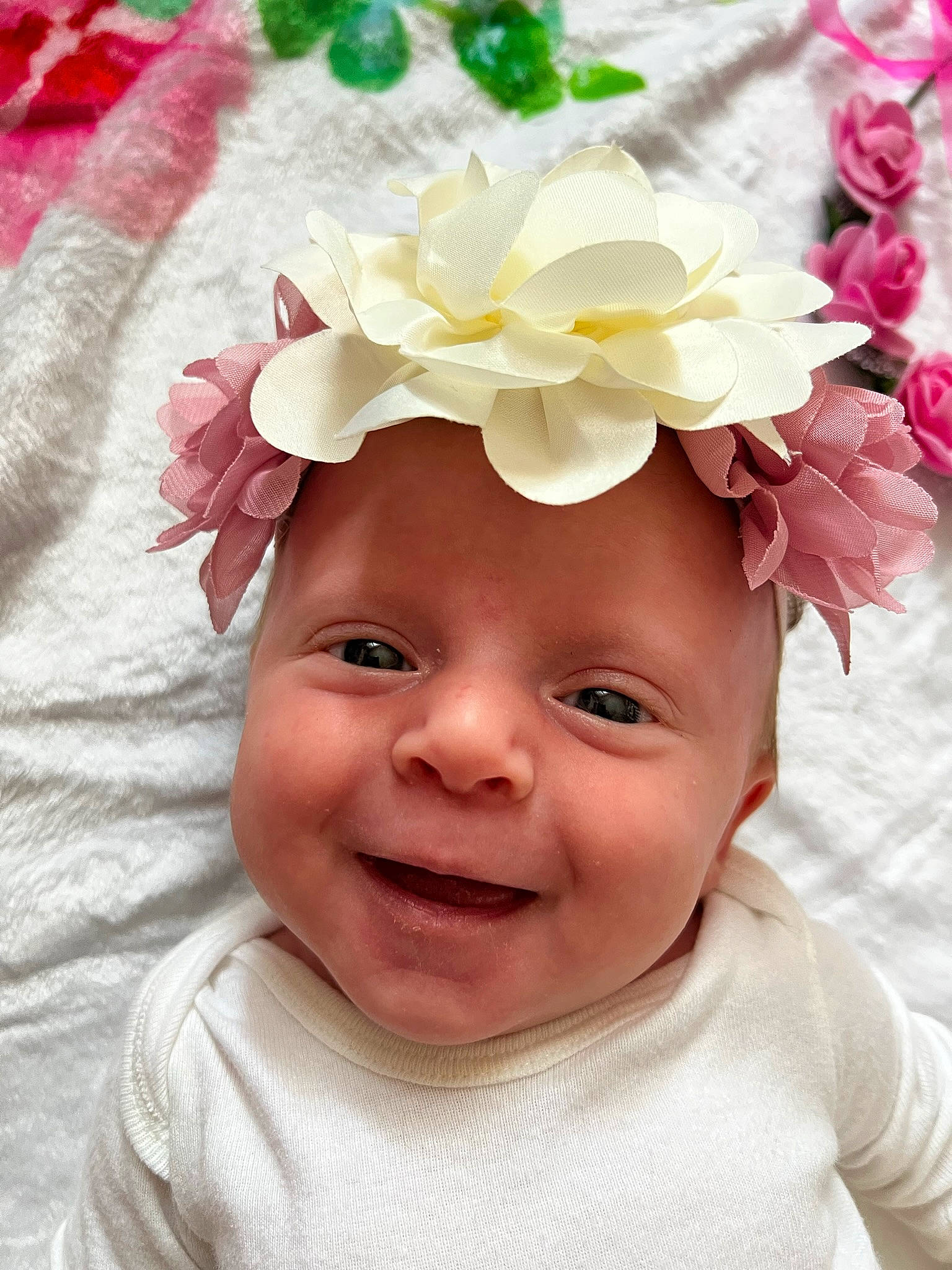 Elizabeth joined the competition — help win amazing prizes! artificial_flower, baby, baby_toddler_clothing, beauty, cap, costume_hat, flower, hair_accessory, happy, hat, headgear, headpiece, headwear, magenta, person, petal, pink, product, smile, textile