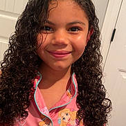 Emma joined the competition — help win amazing prizes! child, girl, curly_hair, smile, pajamas, cartoon_characters, indoor, door, clothing, portrait, happy, young, person, room, casual, curly, long_hair, fashion, cute, face