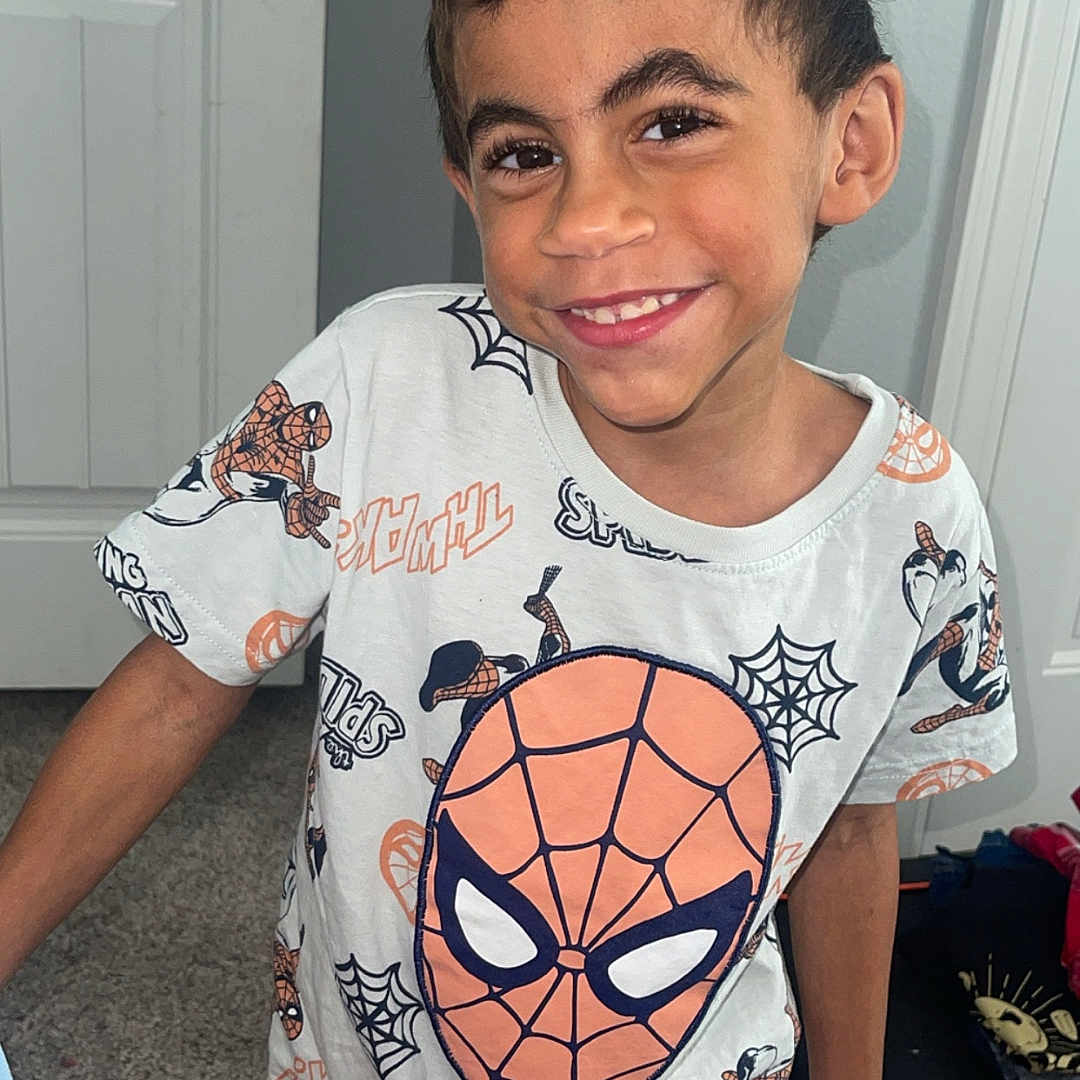 Oliver joined the competition — help win amazing prizes! boy, carpet, casual, child, clothing, cute, door, face, fashion, happy, home, indoor, person, playful, portrait, shorts, smiling, spiderman, tshirt, young