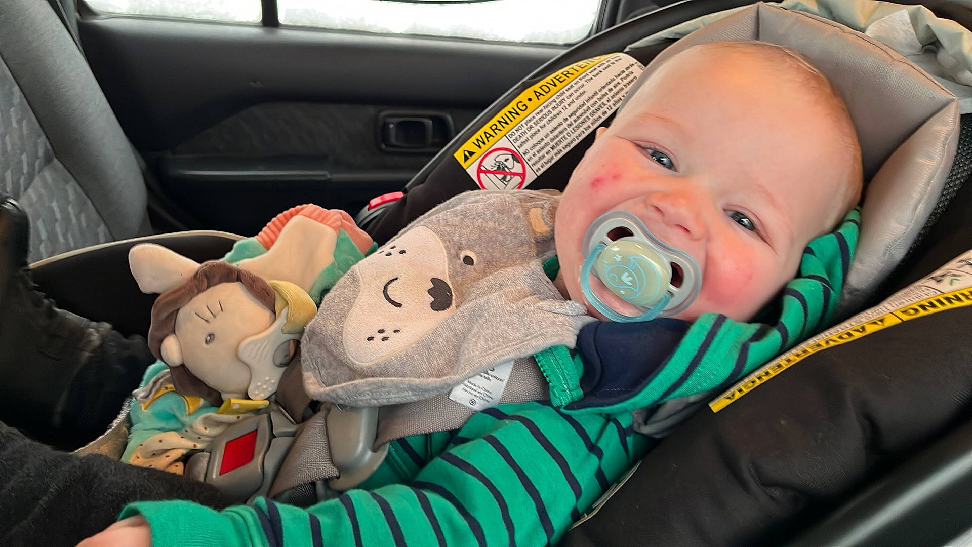 Kaleb is registered to the contest to win money with this photo: automotive_design, baby, baby_carriage, baby_products, baby_safety, baby_toddler_clothing, car_seat, cheek, child, comfort, finger, fun, mammal, motor_vehicle, person, product, skin, toddler, toy, vehicle
