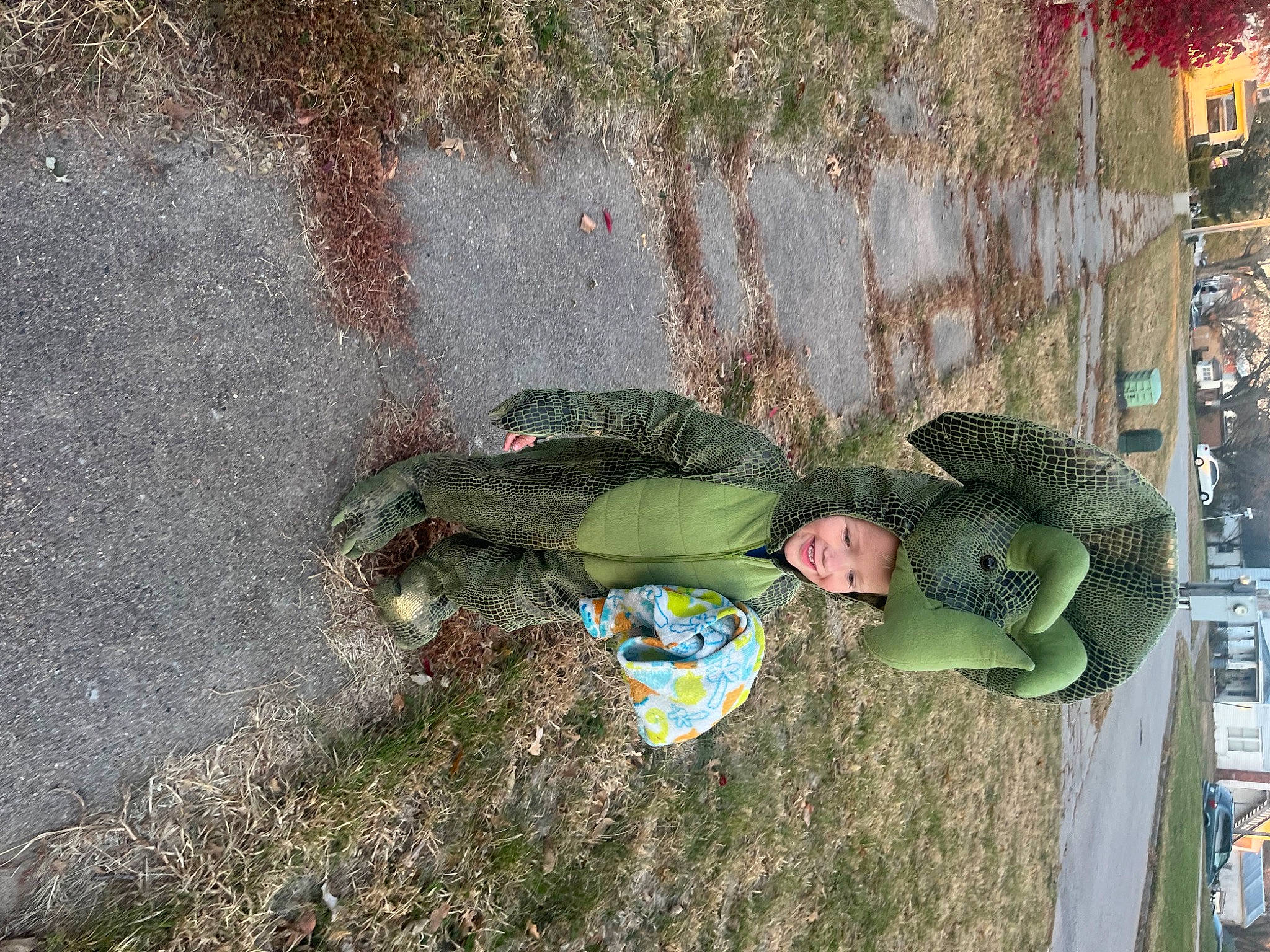 Ashton is registered to the contest to win money with this photo: asphalt, camouflage, concrete, fun, grass, headwear, joy, leisure, military_camouflage, military_uniform, pattern, people_in_nature, person, road_surface, shadow, soil, tree, visual_arts, winter