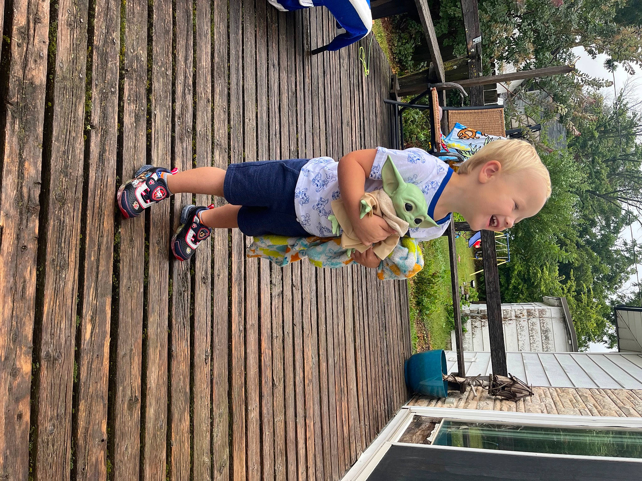 Ashton joined the competition — help win amazing prizes! adventure, child, electric_blue, fun, grass, hardwood, leisure, outdoor_shoe, person, plant, recreation, rope, shorts, t_shirt, thigh, toddler, tree, wood