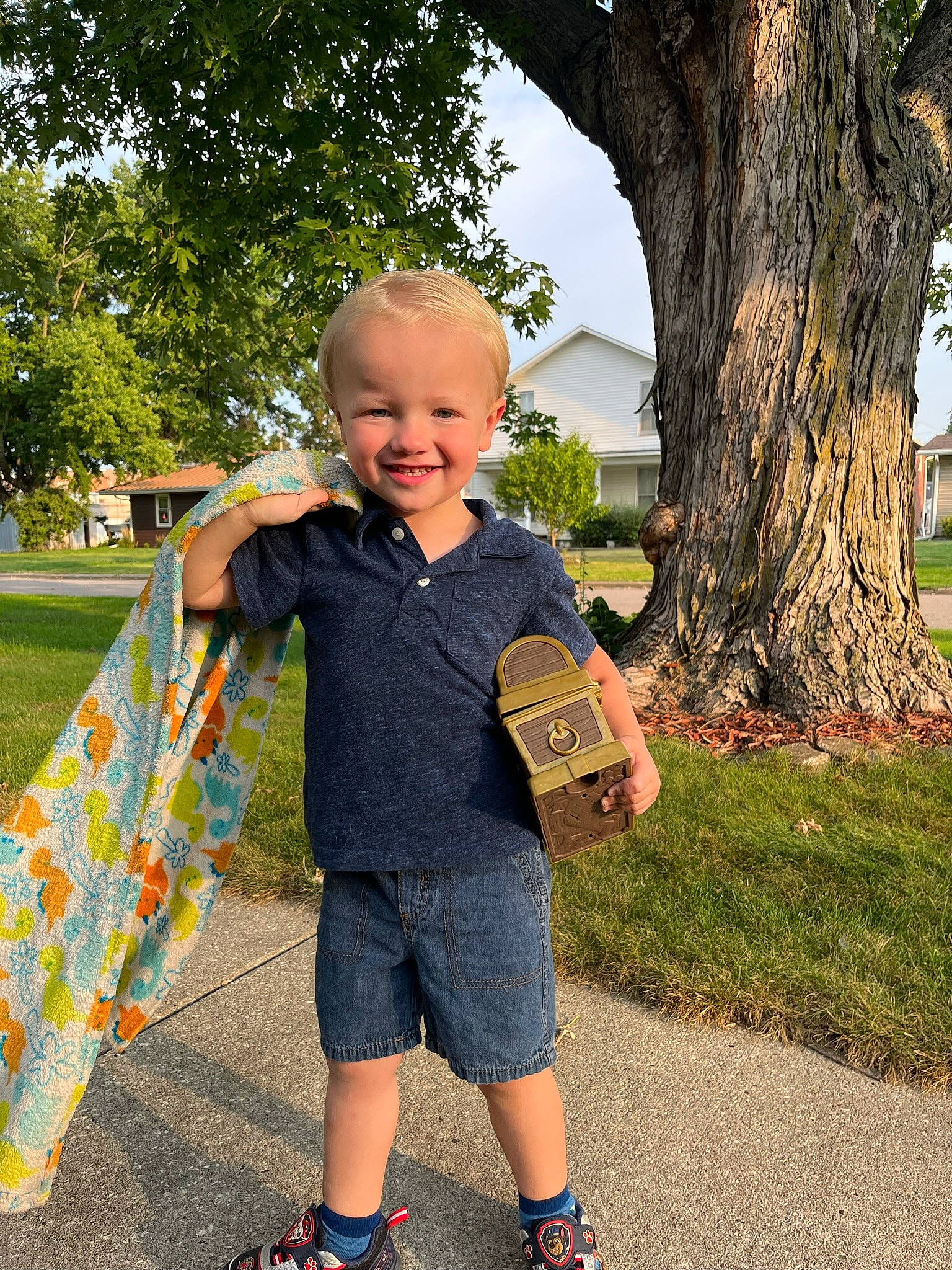 Ashton is registered to the contest to win money with this photo: child, electric_blue, fun, garden, grass, happy, joy, lawn, leisure, pattern, people_in_nature, person, plant, public_space, recreation, shorts, sky, smile, spring, t_shirt