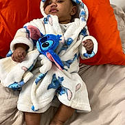 Terrell joined the competition — help win amazing prizes! baby, child, robe, plush, bed, pillow, orange, white, blue, foot, hand, face, clothing, indoor, cute, infant, soft, blanket, person, relaxing