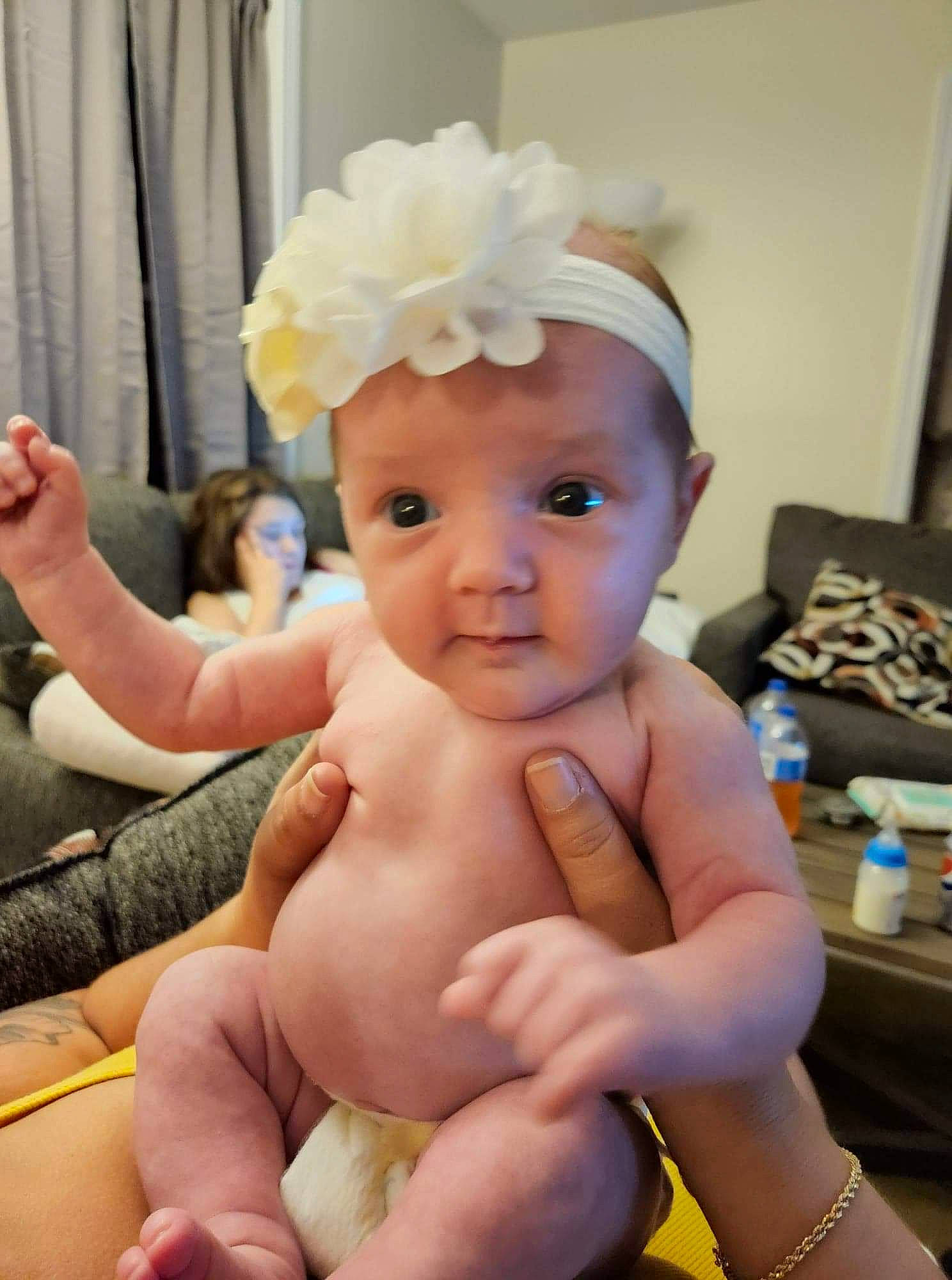 Adelynn joined the competition — help win amazing prizes! abdomen, baby, baby_toddler_clothing, blurred, child, comfort, curtain, eye, foot, hairstyle, hand, happy, hat, knee, lip, person, product, skin, thigh, thumb