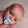 Arthur joined the competition — help win amazing prizes! baby, infant, pacifier, close_up, face, skin, head, eyes, hand, lying_down, soft_surface, newborn, cute, child, portrait, expression, calm, resting, naked, human