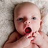 baby, infant, face, skin, hands, mouth, eyes, blanket, soft, expression, newborn, cute, portrait, closeup, fingers, child, lying_down, human, adorable, fluffy