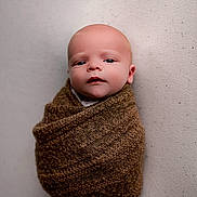 Arthur is registered to the contest to win money with this photo: baby, infant, wrapped, blanket, brown, cozy, portrait, face, newborn, cute, soft, knit, child, person, expression, indoor, bundle, skin, head, small