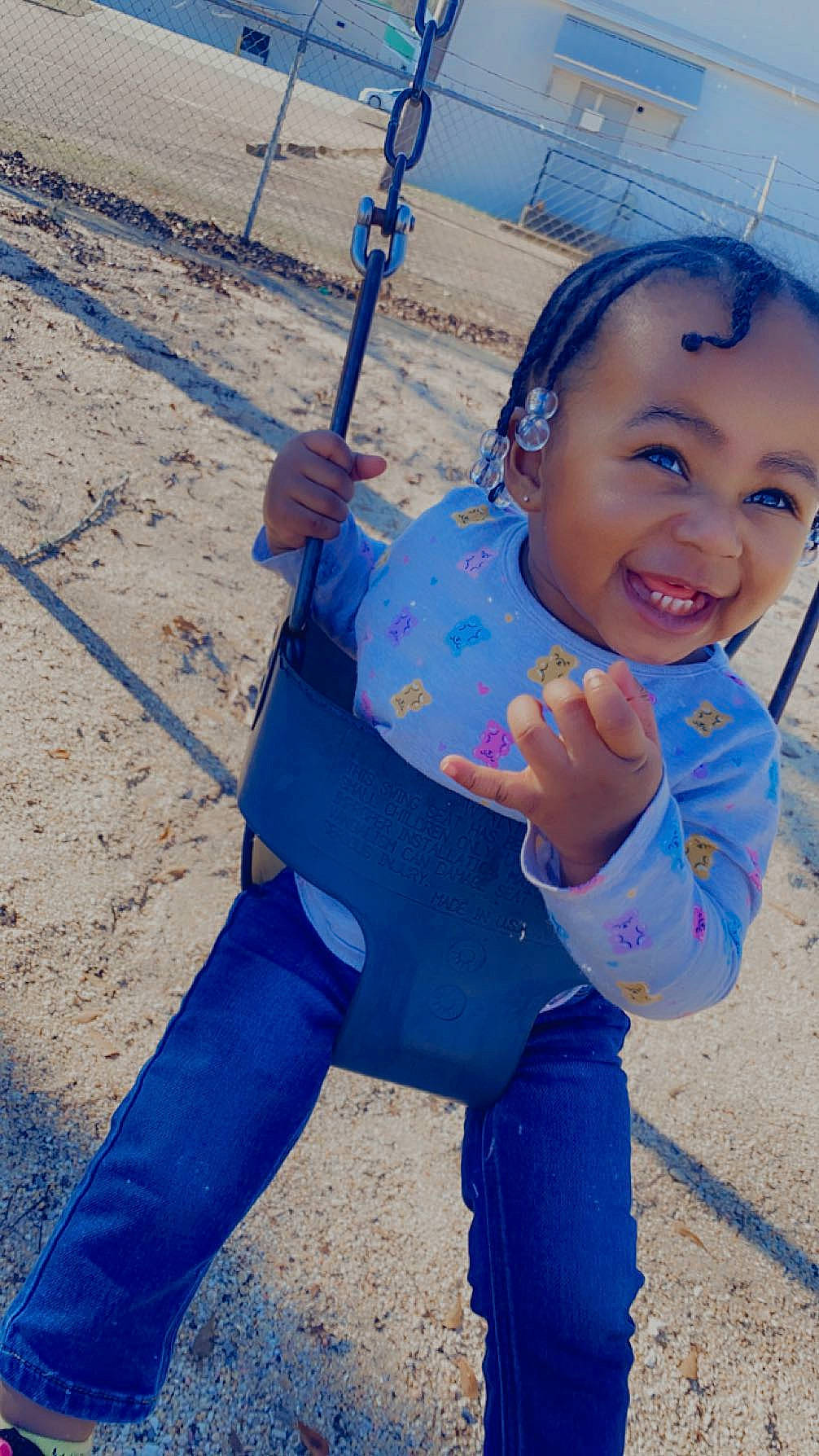 Maleah joined the competition — help win amazing prizes! azure, blue, city, cool, denim, electric_blue, fun, happy, joy, leisure, outdoor_play_equipment, person, play, playground, recreation, sand, sitting, smile, soil, swing