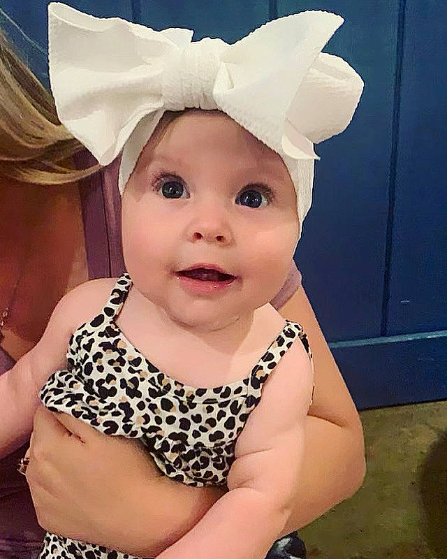 Oaklynn is registered to the contest to win money with this photo: baby, baby_toddler_clothing, blond, child, cool, costume_hat, eye, eyelash, face, facial_expression, fun, happy, head, headband, headgear, headpiece, headwear, jewellery, person, pink