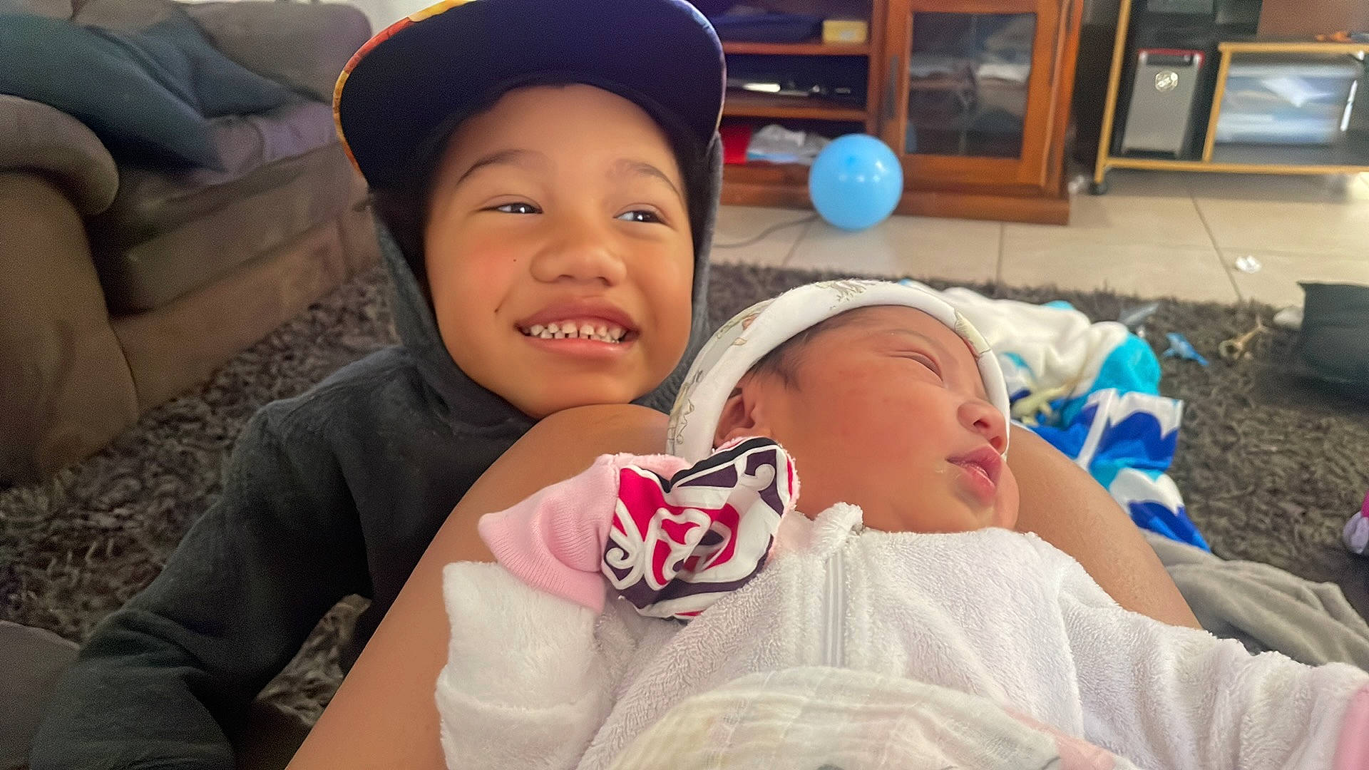 Alira joined the competition — help win amazing prizes! baby, cap, cheek, child, chin, comfort, event, eye, face, fun, happy, hat, headgear, headwear, joy, lip, mouth, nose, person, skin