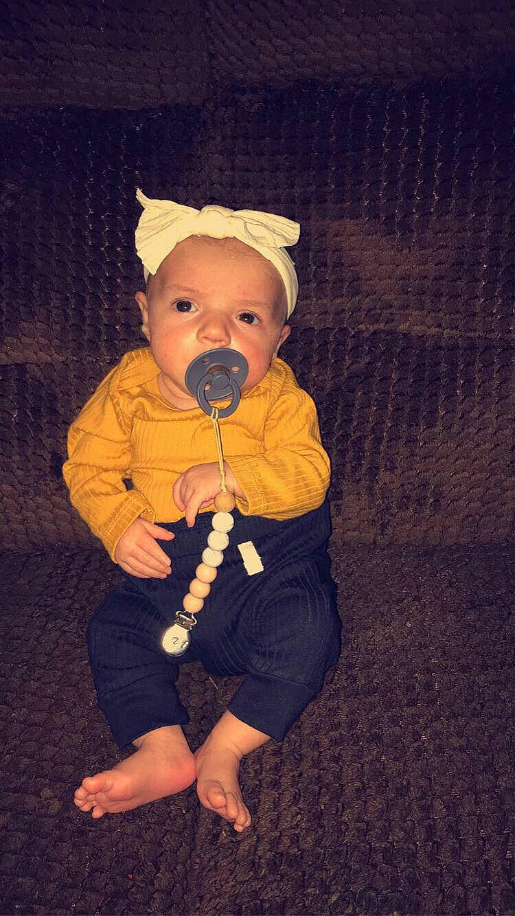 Riverlynn is registered to the contest to win money with this photo: baby, baby_toddler_clothing, cheek, child, costume_hat, eye, finger, flash_photography, flooring, foot, fun, fur, gesture, happy, hat, person, shadow, sitting, sleeve, toddler