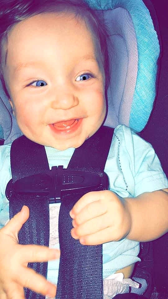 Desmond is registered to the contest to win money with this photo: azure, baby, baby_toddler_clothing, blue, cheek, cool, electric_blue, finger, gesture, hand, happy, iris, joy, nail, nose, outerwear, person, skin, sleeve, smile