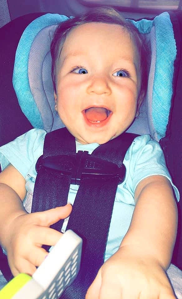 Desmond is registered to the contest to win money with this photo: azure, baby, baby_toddler_clothing, blue, cheek, comfort, eyebrow, finger, happy, iris, mouth, nose, outerwear, person, photograph, product, purple, skin, sleeve, smile