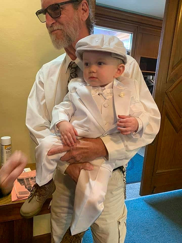 Robert is registered to the contest to win money with this photo: ankle, baby, baby_toddler_clothing, beard, cabinetry, door, ear, facial_hair, fathers_day, foot, grandparent, hand, hat, head, headwear, home_door, moustache, person, shoe, thumb