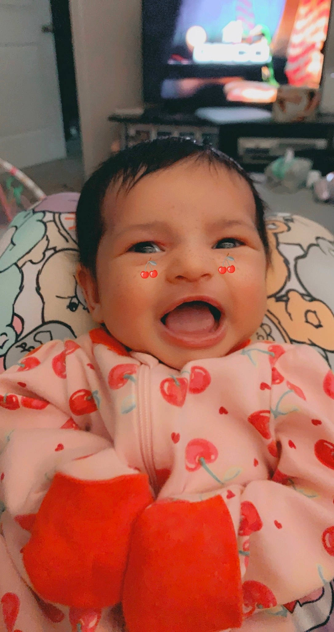 Kehlani is registered to the contest to win money with this photo: baby, baby_toddler_clothing, cheek, child, chin, eye, face, facial_expression, finger, happy, linens, lip, mammal, mouth, nose, pattern, person, skin, sleeve, smile